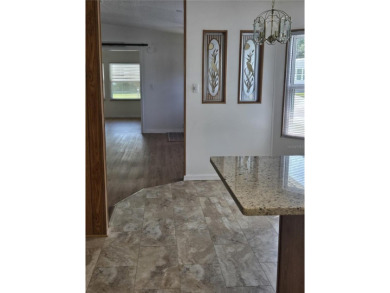 ZELLWOOD STATION Nicely renovated 3-bedroom 2 bath home, Move in on Zellwood Station Country Club in Florida - for sale on GolfHomes.com, golf home, golf lot