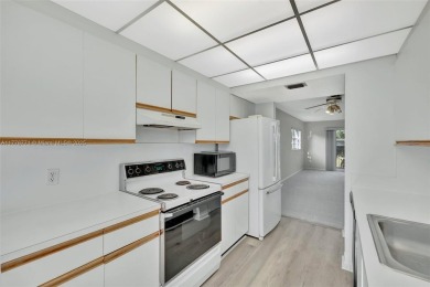 Breathtaking 2 bedroom, 2 bathroom corner unit with view on Flamingo Lakes Country Club in Florida - for sale on GolfHomes.com, golf home, golf lot
