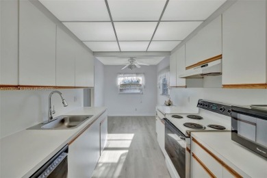 Breathtaking 2 bedroom, 2 bathroom corner unit with view on Flamingo Lakes Country Club in Florida - for sale on GolfHomes.com, golf home, golf lot