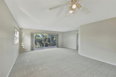 Breathtaking 2 bedroom, 2 bathroom corner unit with view on Flamingo Lakes Country Club in Florida - for sale on GolfHomes.com, golf home, golf lot