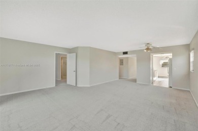 Breathtaking 2 bedroom, 2 bathroom corner unit with view on Flamingo Lakes Country Club in Florida - for sale on GolfHomes.com, golf home, golf lot