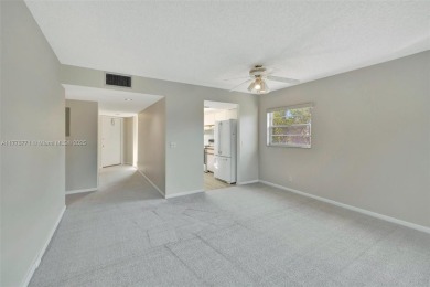 Breathtaking 2 bedroom, 2 bathroom corner unit with view on Flamingo Lakes Country Club in Florida - for sale on GolfHomes.com, golf home, golf lot