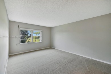 Breathtaking 2 bedroom, 2 bathroom corner unit with view on Flamingo Lakes Country Club in Florida - for sale on GolfHomes.com, golf home, golf lot