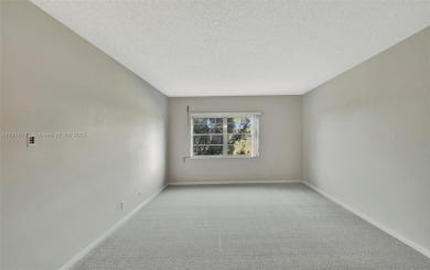 Breathtaking 2 bedroom, 2 bathroom corner unit with view on Flamingo Lakes Country Club in Florida - for sale on GolfHomes.com, golf home, golf lot
