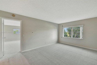 Breathtaking 2 bedroom, 2 bathroom corner unit with view on Flamingo Lakes Country Club in Florida - for sale on GolfHomes.com, golf home, golf lot
