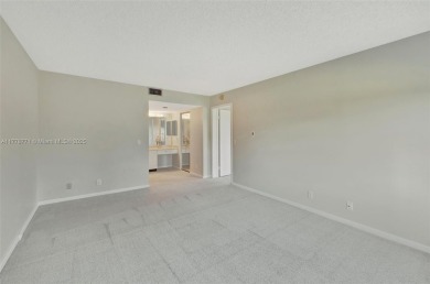 Breathtaking 2 bedroom, 2 bathroom corner unit with view on Flamingo Lakes Country Club in Florida - for sale on GolfHomes.com, golf home, golf lot