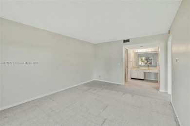 Breathtaking 2 bedroom, 2 bathroom corner unit with view on Flamingo Lakes Country Club in Florida - for sale on GolfHomes.com, golf home, golf lot
