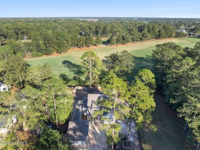 This charming Lowcountry home combines Southern style porches on Oldfield Golf Club in South Carolina - for sale on GolfHomes.com, golf home, golf lot