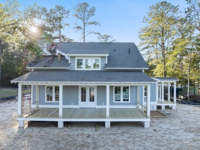 This charming Lowcountry home combines Southern style porches on Oldfield Golf Club in South Carolina - for sale on GolfHomes.com, golf home, golf lot