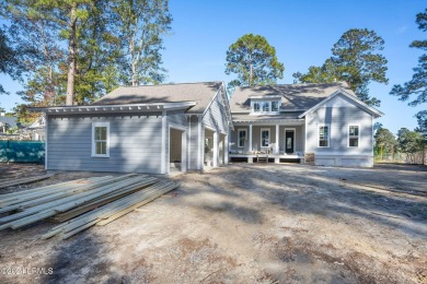 This charming Lowcountry home combines Southern style porches on Oldfield Golf Club in South Carolina - for sale on GolfHomes.com, golf home, golf lot