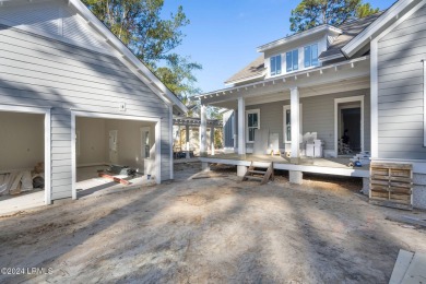 This charming Lowcountry home combines Southern style porches on Oldfield Golf Club in South Carolina - for sale on GolfHomes.com, golf home, golf lot