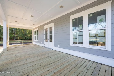 This charming Lowcountry home combines Southern style porches on Oldfield Golf Club in South Carolina - for sale on GolfHomes.com, golf home, golf lot