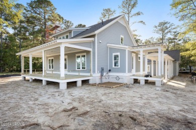 This charming Lowcountry home combines Southern style porches on Oldfield Golf Club in South Carolina - for sale on GolfHomes.com, golf home, golf lot