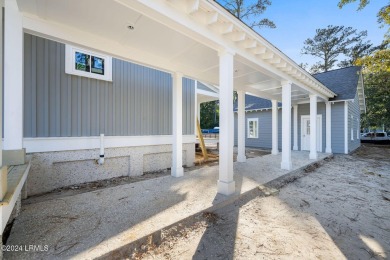 This charming Lowcountry home combines Southern style porches on Oldfield Golf Club in South Carolina - for sale on GolfHomes.com, golf home, golf lot