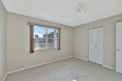 Breathtaking 2 bedroom, 2 bathroom corner unit with view on Flamingo Lakes Country Club in Florida - for sale on GolfHomes.com, golf home, golf lot