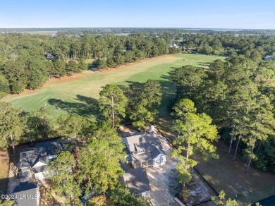 This charming Lowcountry home combines Southern style porches on Oldfield Golf Club in South Carolina - for sale on GolfHomes.com, golf home, golf lot