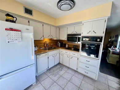 This beautifully maintained end-unit condo features two spacious on On Top Of The World Golf Course in Florida - for sale on GolfHomes.com, golf home, golf lot