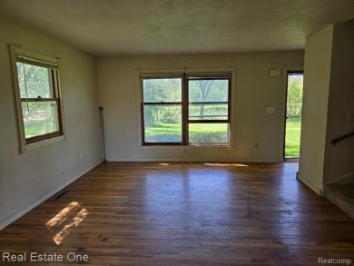 WOW! Don't miss this 1-ACRE Property with Cape Cod style home on The Medalist Golf Club in Michigan - for sale on GolfHomes.com, golf home, golf lot