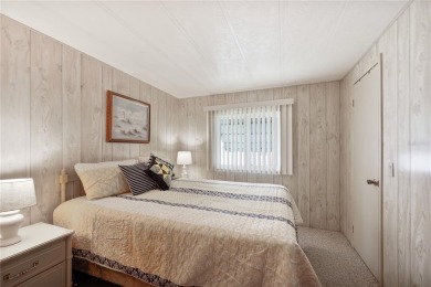 This beautifully maintained 2-bedroom, 2-bath home is located in on Maple Leaf Golf and Country Club in Florida - for sale on GolfHomes.com, golf home, golf lot