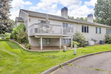 CONTEMPORARY SUMMIT TOWNSHIP END-UNIT CONDO FEATURING MAIN FLOOR on Country Club of Jackson in Michigan - for sale on GolfHomes.com, golf home, golf lot