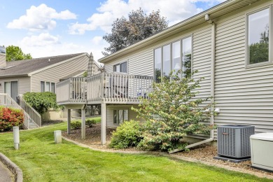 CONTEMPORARY SUMMIT TOWNSHIP END-UNIT CONDO FEATURING MAIN FLOOR on Country Club of Jackson in Michigan - for sale on GolfHomes.com, golf home, golf lot