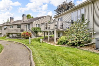 CONTEMPORARY SUMMIT TOWNSHIP END-UNIT CONDO FEATURING MAIN FLOOR on Country Club of Jackson in Michigan - for sale on GolfHomes.com, golf home, golf lot