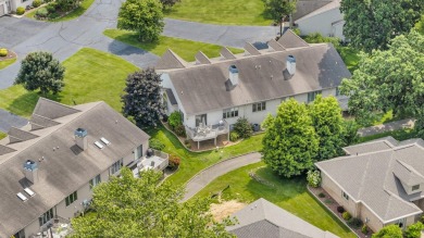 CONTEMPORARY SUMMIT TOWNSHIP END-UNIT CONDO FEATURING MAIN FLOOR on Country Club of Jackson in Michigan - for sale on GolfHomes.com, golf home, golf lot