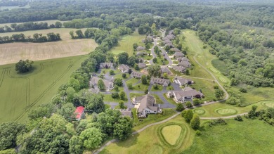 CONTEMPORARY SUMMIT TOWNSHIP END-UNIT CONDO FEATURING MAIN FLOOR on Country Club of Jackson in Michigan - for sale on GolfHomes.com, golf home, golf lot