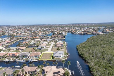 PUNTA GORDA ISLES WATERFRONT LOT - Vacant lot in PGI w/concrete on Saint Andrews South Golf Club in Florida - for sale on GolfHomes.com, golf home, golf lot