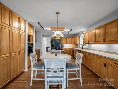 Beautiful resort home on 2.4 private wooded acres within minutes on Rumbling Bald Resort on Lake Lure in North Carolina - for sale on GolfHomes.com, golf home, golf lot