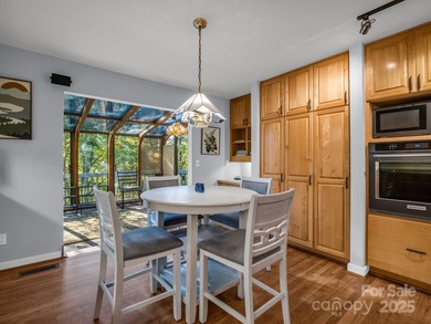 Beautiful resort home on 2.4 private wooded acres within minutes on Rumbling Bald Resort on Lake Lure in North Carolina - for sale on GolfHomes.com, golf home, golf lot