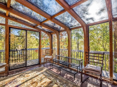 Beautiful resort home on 2.4 private wooded acres within minutes on Rumbling Bald Resort on Lake Lure in North Carolina - for sale on GolfHomes.com, golf home, golf lot