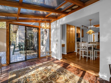 Beautiful resort home on 2.4 private wooded acres within minutes on Rumbling Bald Resort on Lake Lure in North Carolina - for sale on GolfHomes.com, golf home, golf lot