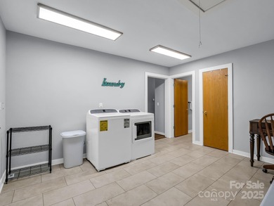 Beautiful resort home on 2.4 private wooded acres within minutes on Rumbling Bald Resort on Lake Lure in North Carolina - for sale on GolfHomes.com, golf home, golf lot