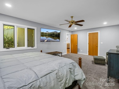 Beautiful resort home on 2.4 private wooded acres within minutes on Rumbling Bald Resort on Lake Lure in North Carolina - for sale on GolfHomes.com, golf home, golf lot