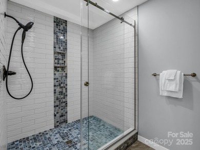 Beautiful resort home on 2.4 private wooded acres within minutes on Rumbling Bald Resort on Lake Lure in North Carolina - for sale on GolfHomes.com, golf home, golf lot