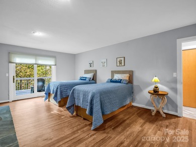 Beautiful resort home on 2.4 private wooded acres within minutes on Rumbling Bald Resort on Lake Lure in North Carolina - for sale on GolfHomes.com, golf home, golf lot