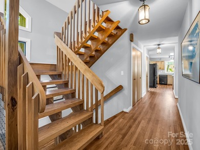 Beautiful resort home on 2.4 private wooded acres within minutes on Rumbling Bald Resort on Lake Lure in North Carolina - for sale on GolfHomes.com, golf home, golf lot