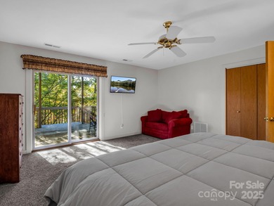 Beautiful resort home on 2.4 private wooded acres within minutes on Rumbling Bald Resort on Lake Lure in North Carolina - for sale on GolfHomes.com, golf home, golf lot