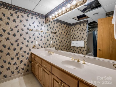 Beautiful resort home on 2.4 private wooded acres within minutes on Rumbling Bald Resort on Lake Lure in North Carolina - for sale on GolfHomes.com, golf home, golf lot