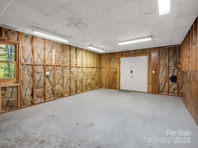 Beautiful resort home on 2.4 private wooded acres within minutes on Rumbling Bald Resort on Lake Lure in North Carolina - for sale on GolfHomes.com, golf home, golf lot