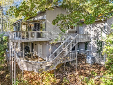 Beautiful resort home on 2.4 private wooded acres within minutes on Rumbling Bald Resort on Lake Lure in North Carolina - for sale on GolfHomes.com, golf home, golf lot