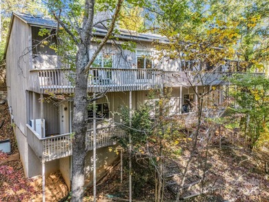 Beautiful resort home on 2.4 private wooded acres within minutes on Rumbling Bald Resort on Lake Lure in North Carolina - for sale on GolfHomes.com, golf home, golf lot