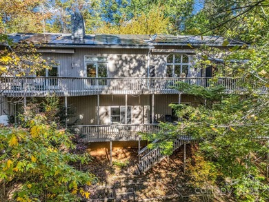 Beautiful resort home on 2.4 private wooded acres within minutes on Rumbling Bald Resort on Lake Lure in North Carolina - for sale on GolfHomes.com, golf home, golf lot