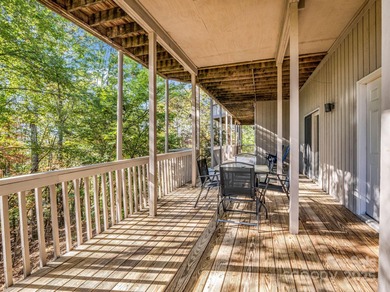 Beautiful resort home on 2.4 private wooded acres within minutes on Rumbling Bald Resort on Lake Lure in North Carolina - for sale on GolfHomes.com, golf home, golf lot