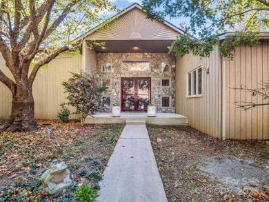 Beautiful resort home on 2.4 private wooded acres within minutes on Rumbling Bald Resort on Lake Lure in North Carolina - for sale on GolfHomes.com, golf home, golf lot