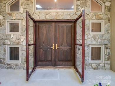 Beautiful resort home on 2.4 private wooded acres within minutes on Rumbling Bald Resort on Lake Lure in North Carolina - for sale on GolfHomes.com, golf home, golf lot