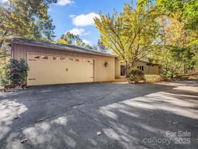 Beautiful resort home on 2.4 private wooded acres within minutes on Rumbling Bald Resort on Lake Lure in North Carolina - for sale on GolfHomes.com, golf home, golf lot