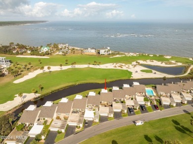 Discover the perfect coastal retreat at 123 Ocean Point Drive on Ocean Point Golf Links in South Carolina - for sale on GolfHomes.com, golf home, golf lot