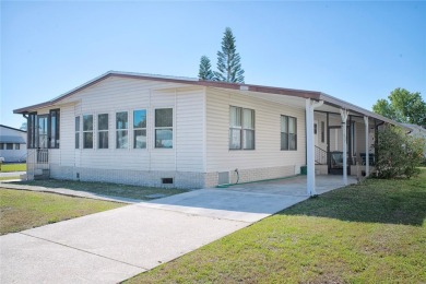 This home sits on a corner lot near our 18-hole golf course. It on Barefoot Bay Golf Course in Florida - for sale on GolfHomes.com, golf home, golf lot